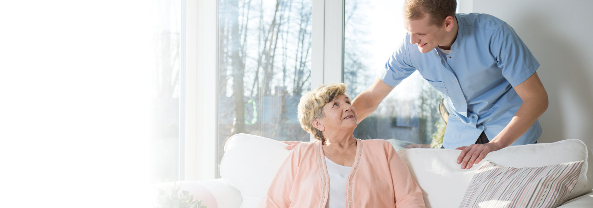 caregiver talking to a senior woman